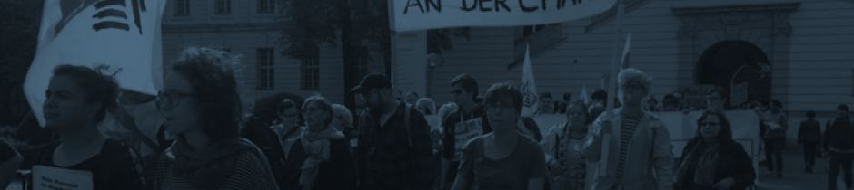 Streikende mit Transparenten am Virchowklinikum im September 2017